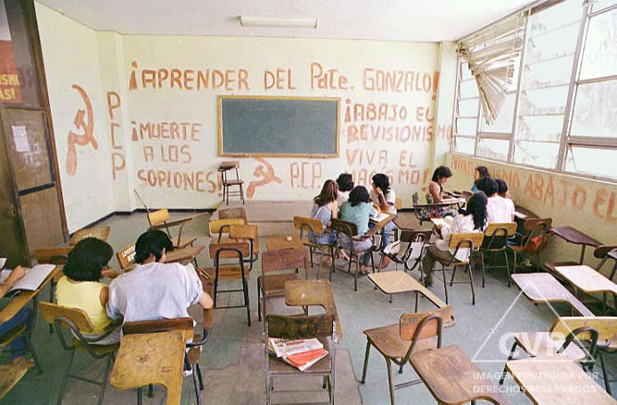 Students surrounded by Senderista pints in a Universidad Nacional Mayor de San Marcos classroom