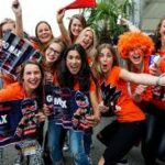 a group of women holding signs