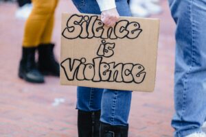 "SILENCE IS VIOLENCE"