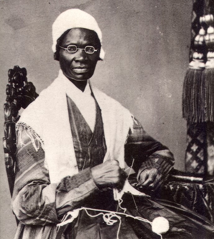 Sojourner Truth is shown in this photograph sitting in a chair and staring thoughtfully into the viewer. Truth is devoted to the struggle for justice and freedom, as shown by the strength in her gaze. She represents grace and strength while wearing simple clothing. Knitting allows her to be humanized, recognizing that she is a person too. The picture perfectly expresses the spirit of a woman who stood up for the rights of African Americans and women. (Portrait of Sojourner Truth in 1864 | From National Portrait Gallery, Smithsonian Institution)