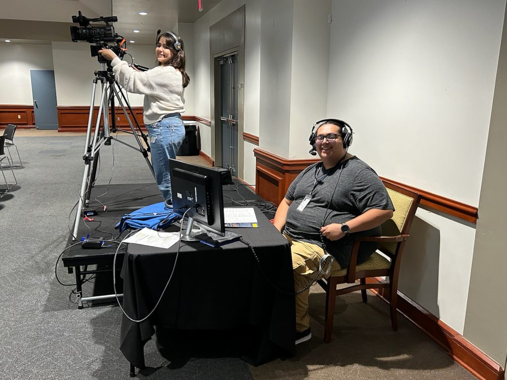 Academic Media Center student workers at a shoot at UC-Mengler Conference Room.